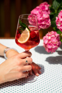 Refreshing cocktail with citrus slices and ice cubes
