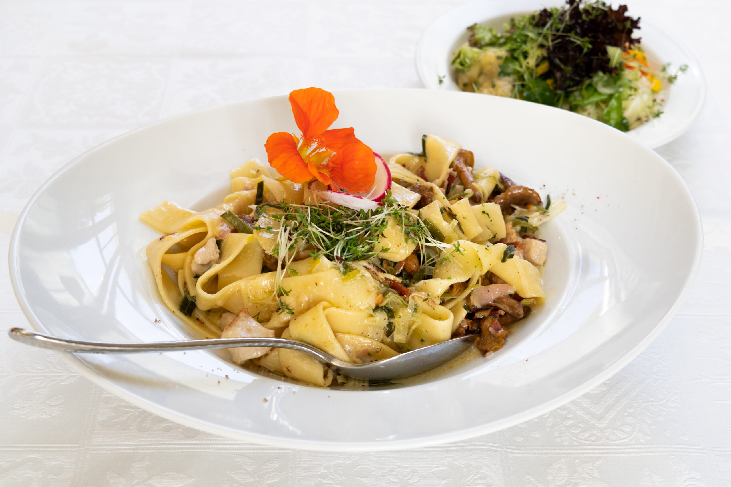 Pasta dish with chanterelle mushrooms and fresh herbs
